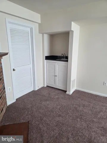 a view of empty room with closet