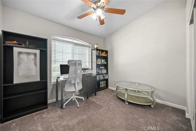 a room with a window and furniture