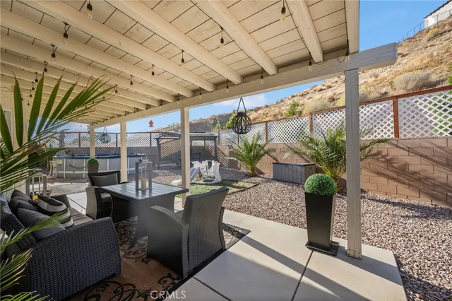 a view of a house with backyard and porch