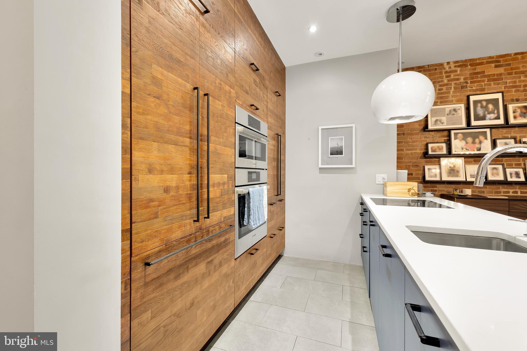 1706 S Street Northwest, Unit 1 Washington, DC 20009 - Photo 14 of 33 a bathroom with a sink and a mirror