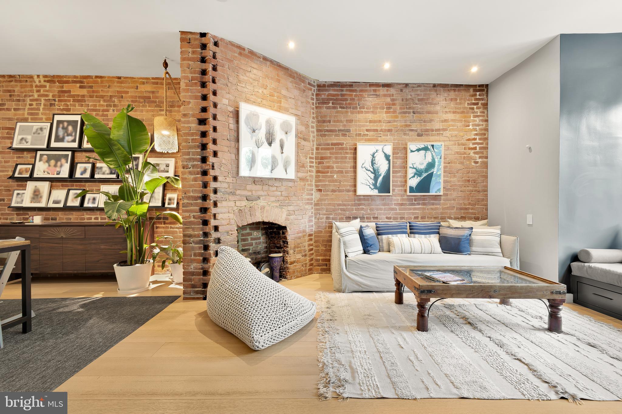 1706 S Street Northwest, Unit 1 Washington, DC 20009 - Photo 2 of 33 a living room with furniture and a fireplace