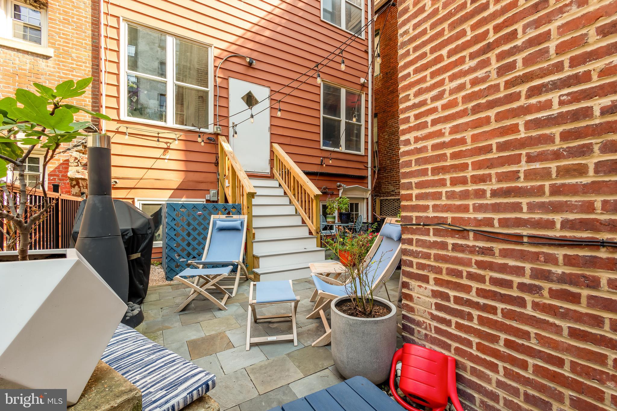 1706 S Street Northwest, Unit 1 Washington, DC 20009 - Photo 30 of 33 a view of a patio with chairs and potted plants