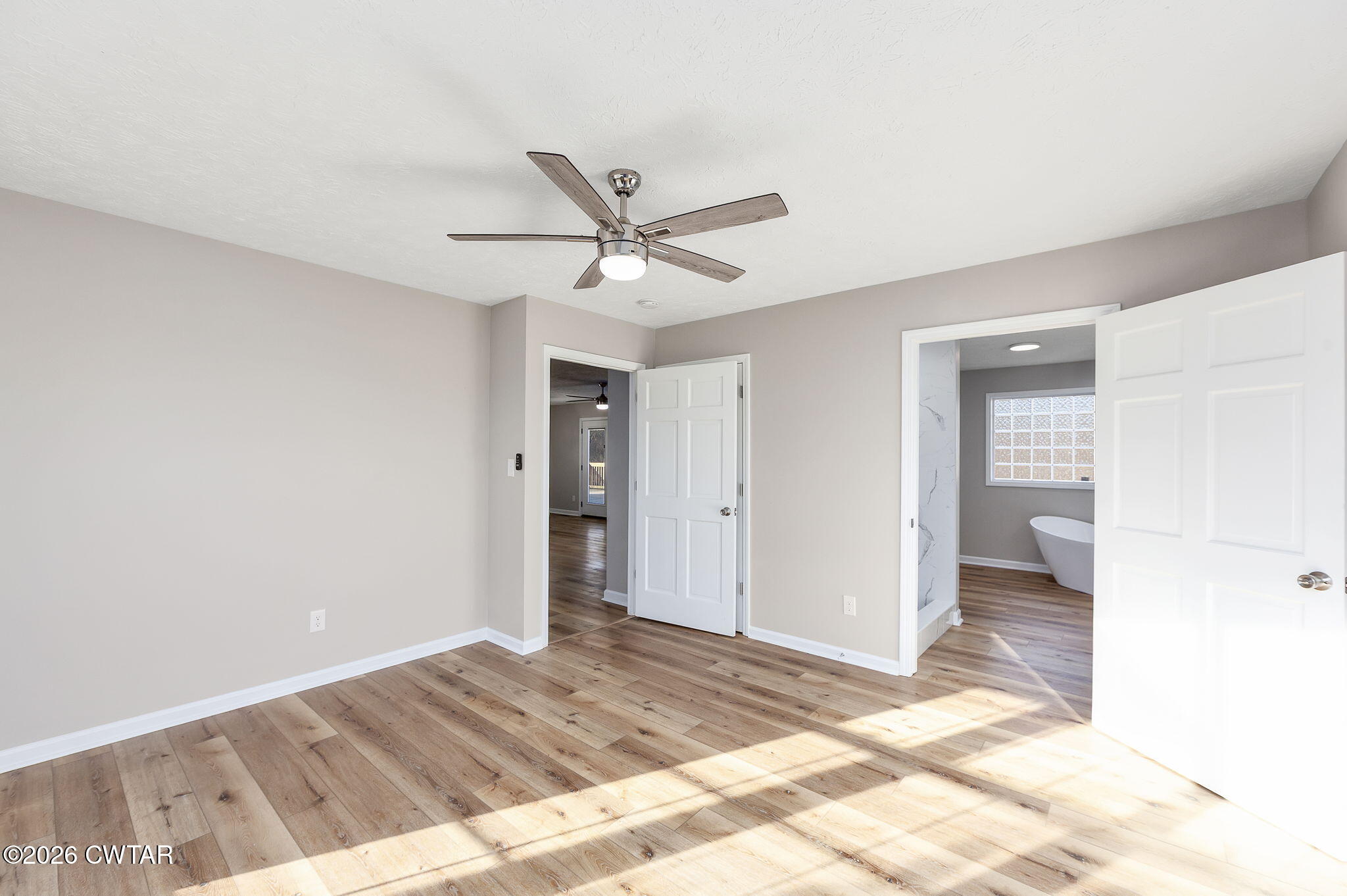 2265 Bond Ferry Road Brownsville, TN 38012 - Photo 13 of 26 a view of a big room with closet and a ceiling fan