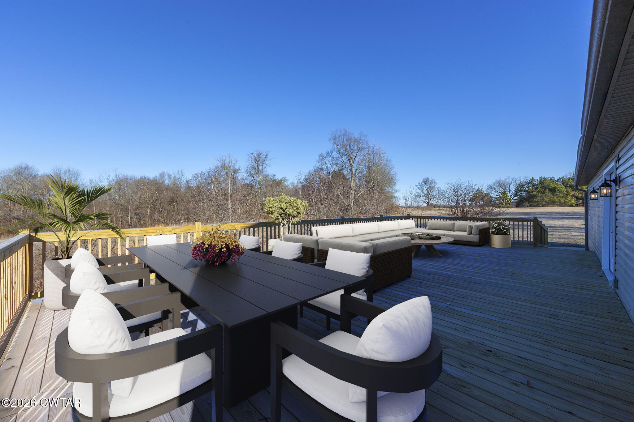2265 Bond Ferry Road Brownsville, TN 38012 - Photo 3 of 26 a terrace of a house with wooden floor and outdoor seating