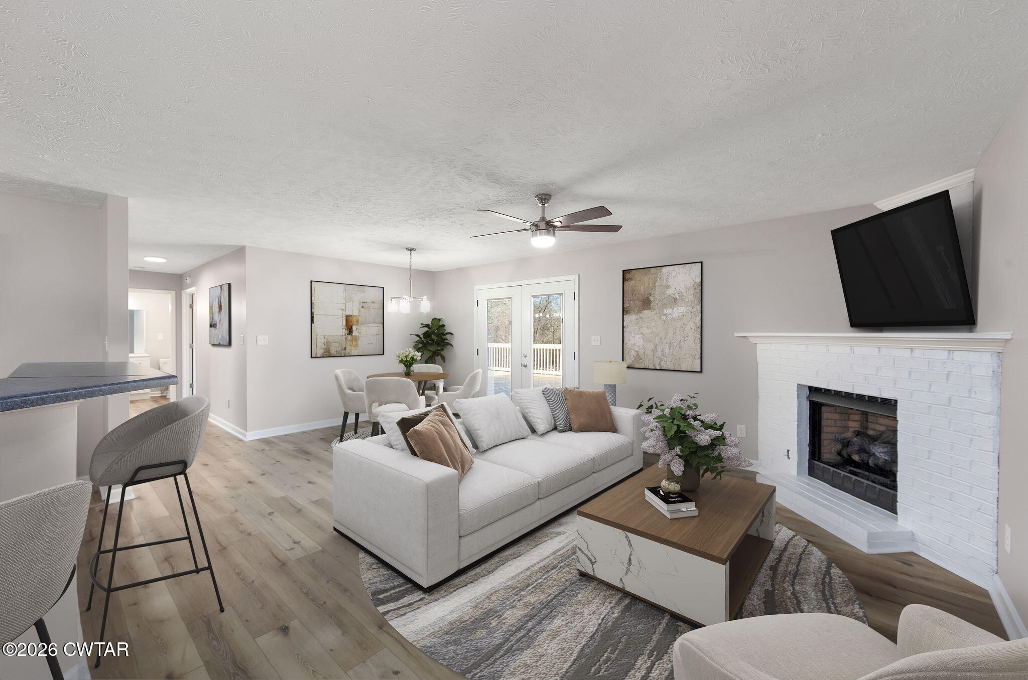 2265 Bond Ferry Road Brownsville, TN 38012 - Photo 6 of 26 a living room with furniture a fireplace and a flat screen tv