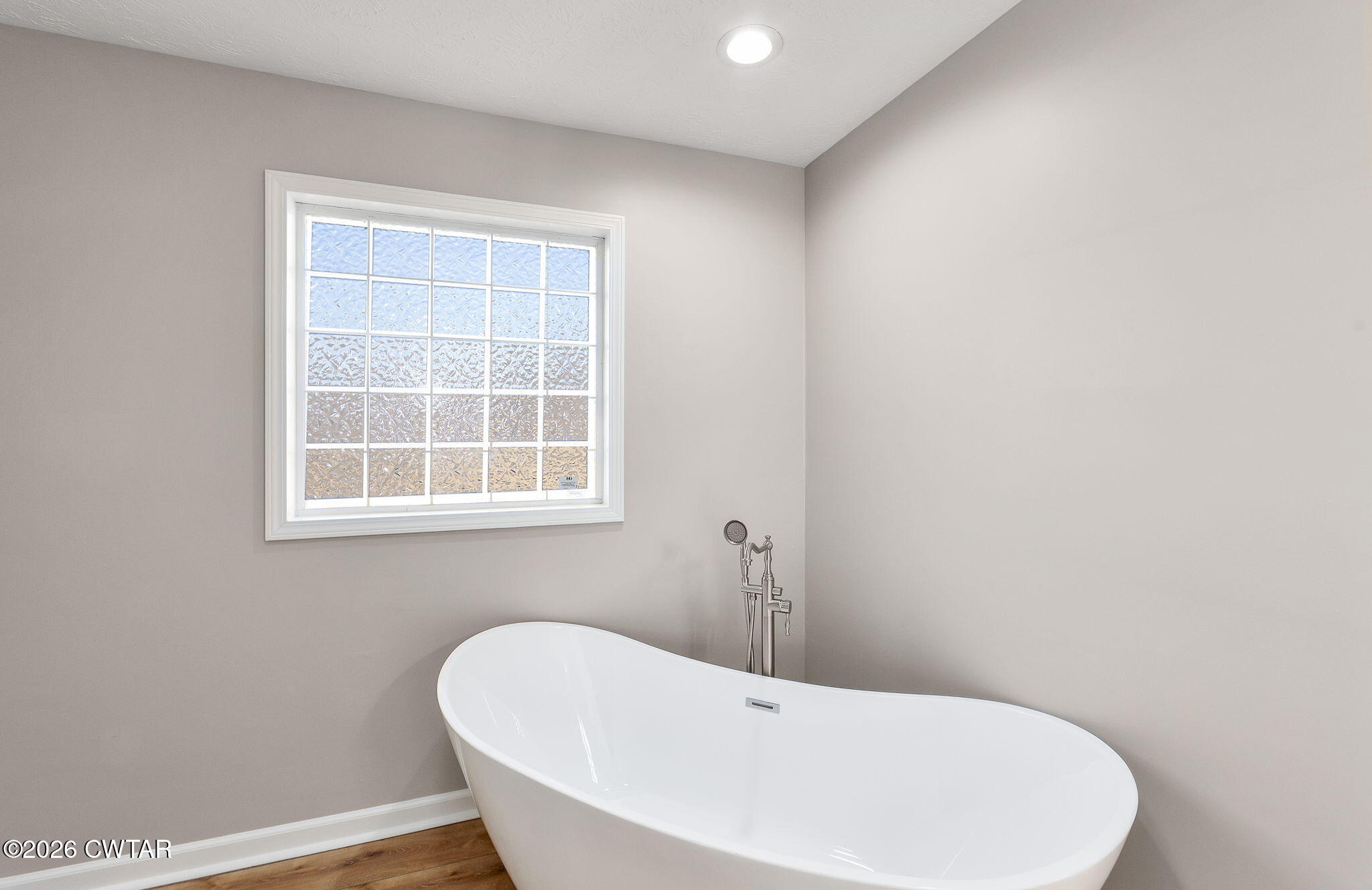 2265 Bond Ferry Road Brownsville, TN 38012 - Photo 9 of 26 a white bath tub sitting in a bathroom