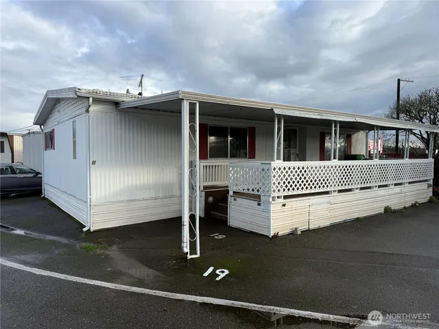 a front view of a house with stairs