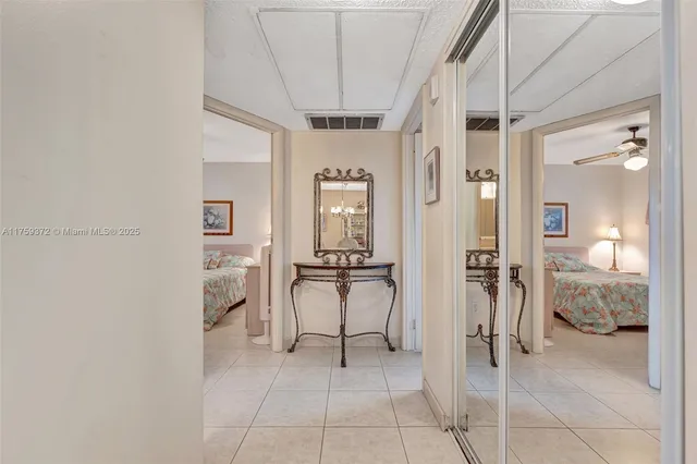 a view of kitchen with furniture and refrigerator