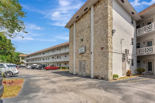a view of a house with stairs and wooden floor