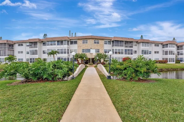 a view of a swimming pool with outdoor seating