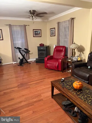 a kitchen with stainless steel appliances kitchen island granite countertop a rug and a window