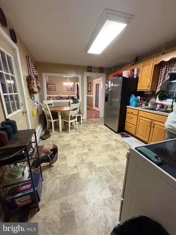 a view of a workspace with furniture and window