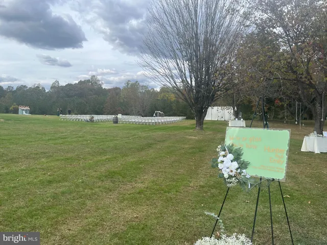 a view of a table and chairs in the garden