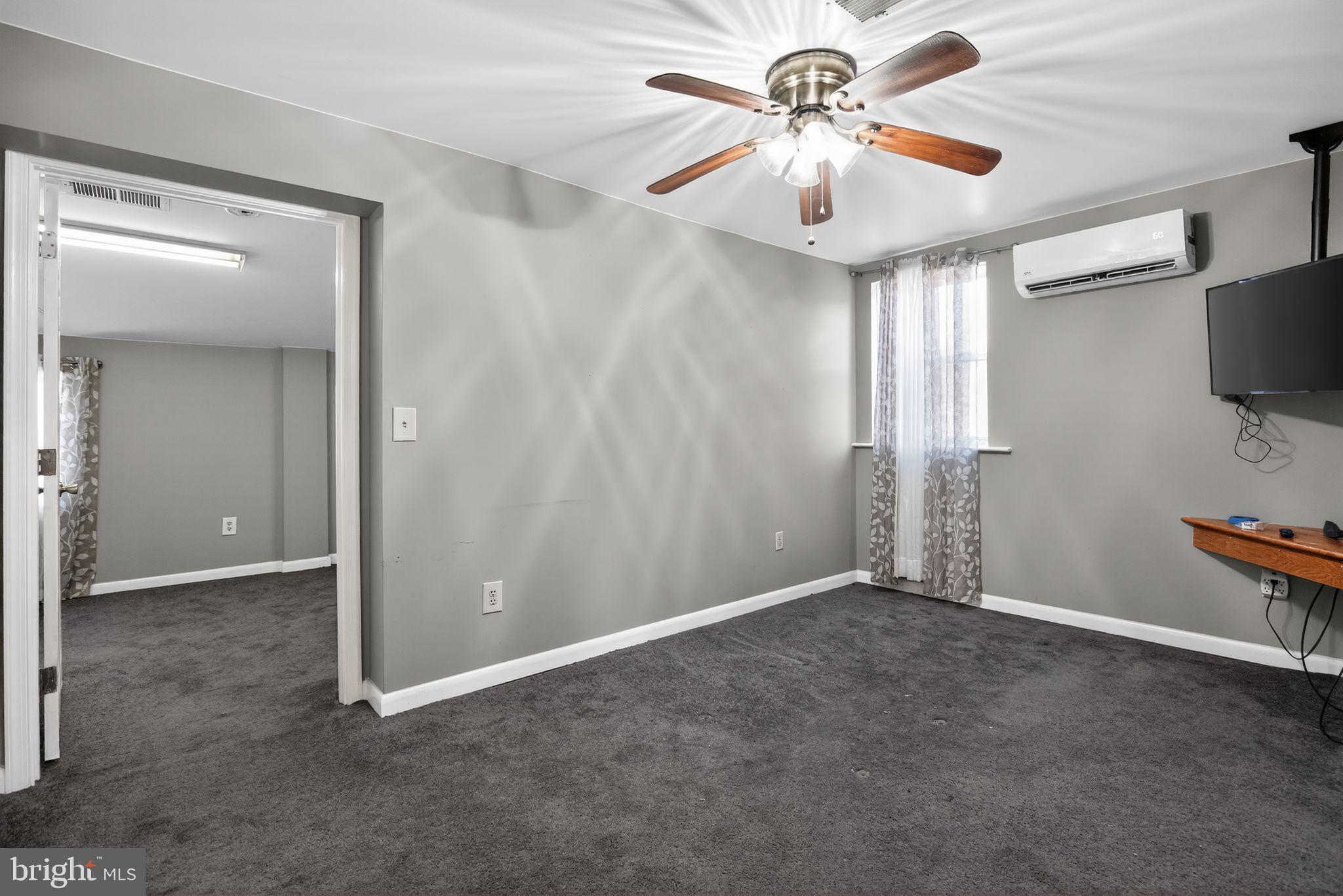 26669 Queentree Road Mechanicsville, MD 20659 - Photo 24 of 48 wooden floor in an empty room with a window