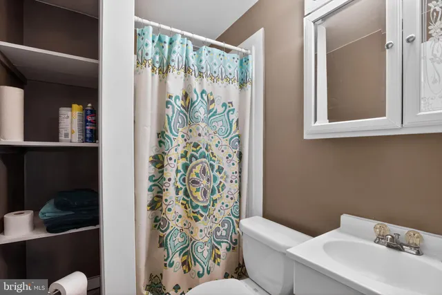 a view of a dining room with furniture wooden floor and chandelier