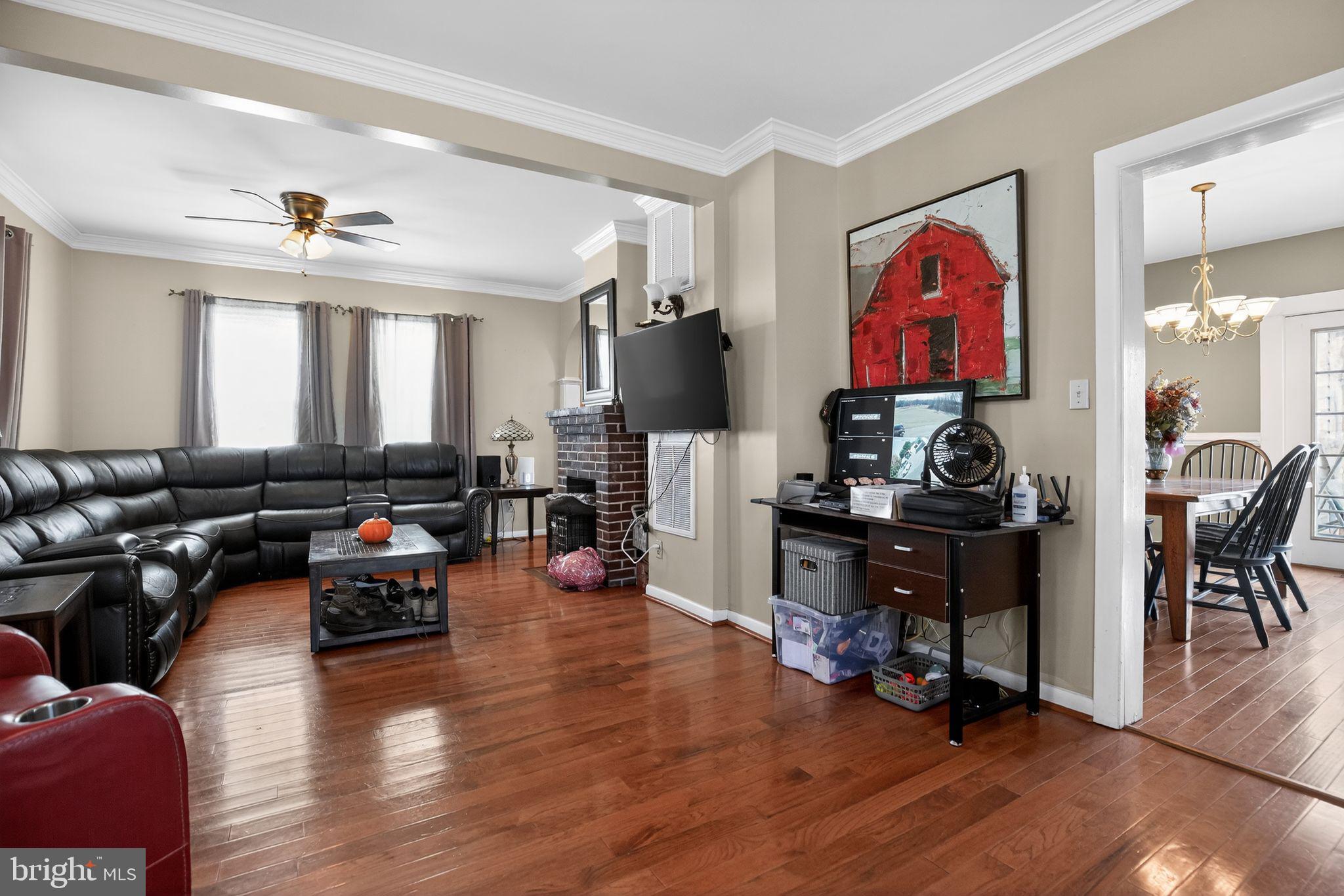 26669 Queentree Road Mechanicsville, MD 20659 - Photo 37 of 48 a living room with furniture and wooden floor