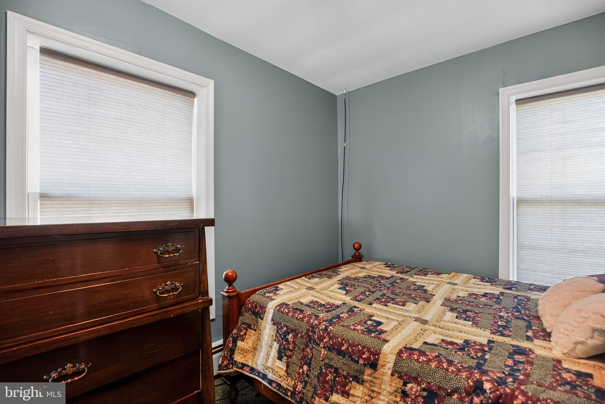 26669 Queentree Road Mechanicsville, MD 20659 - Photo 39 of 48 a bedroom with a bed and a dresser