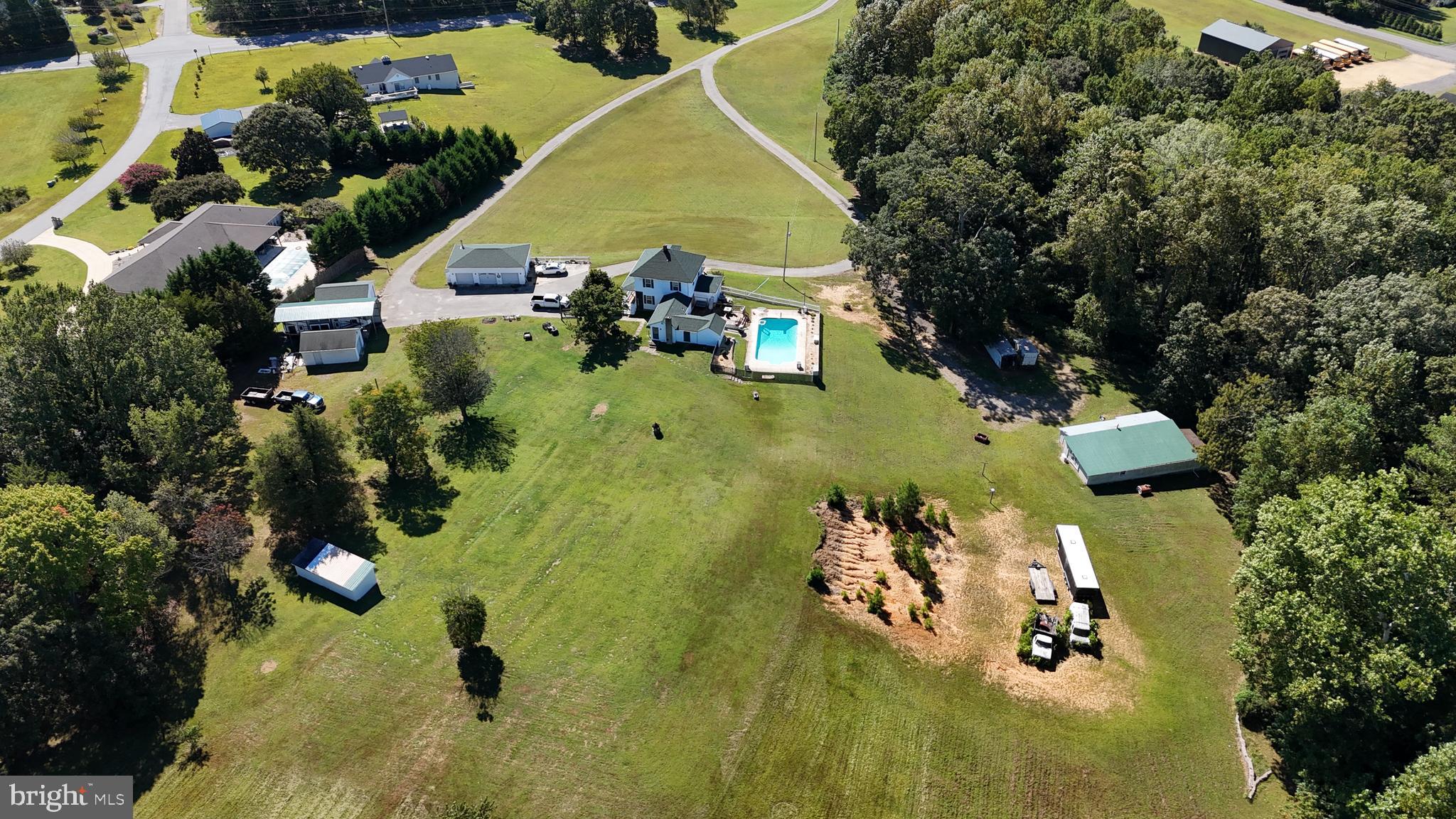 26669 Queentree Road Mechanicsville, MD 20659 - Photo 4 of 48 an aerial view of a residential houses with yard