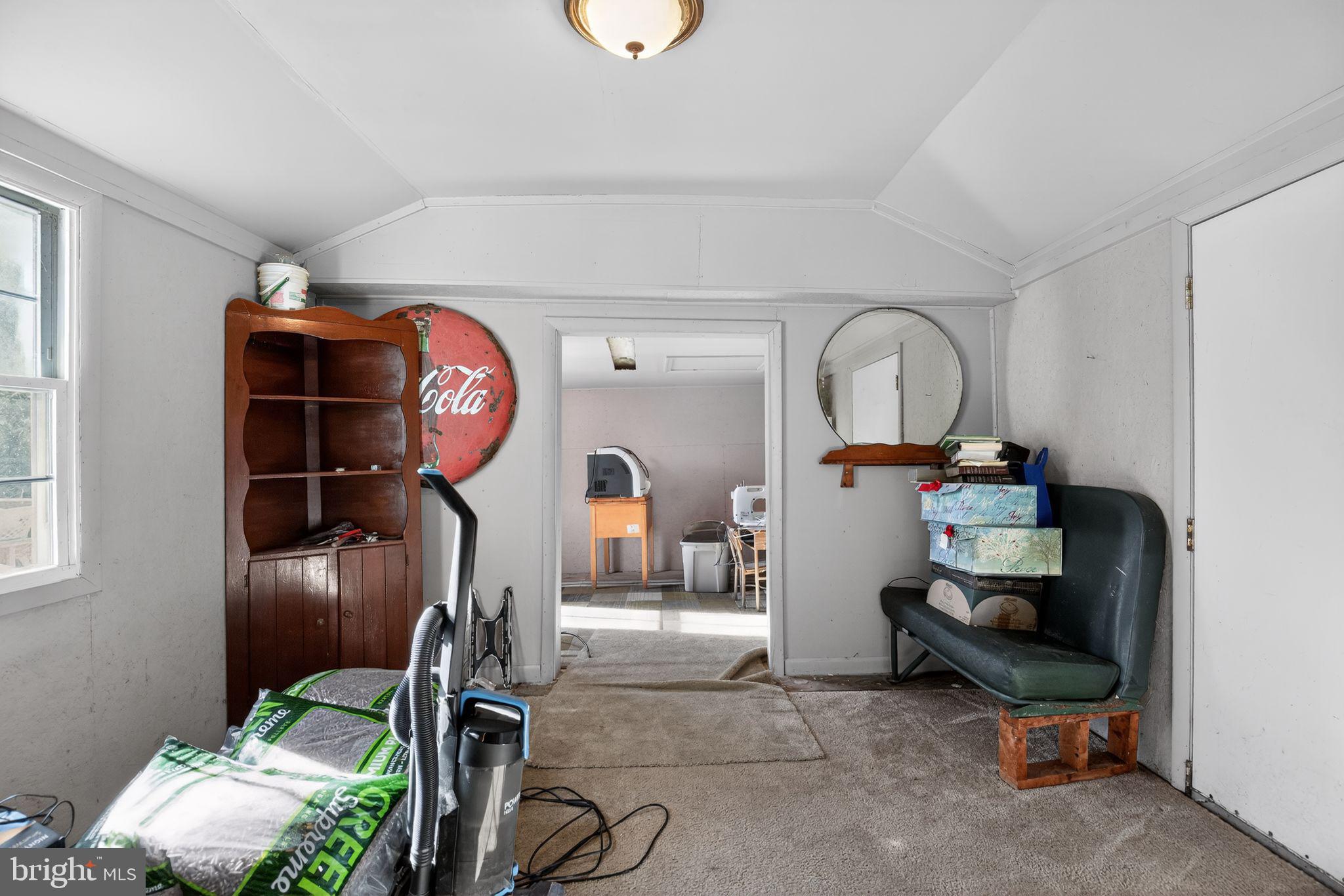 26669 Queentree Road Mechanicsville, MD 20659 - Photo 44 of 48 a room with gym equipment and a mirror