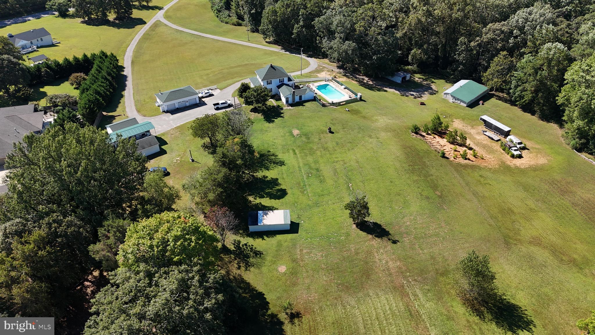 26669 Queentree Road Mechanicsville, MD 20659 - Photo 5 of 48 an aerial view of a residential houses with swimming pool