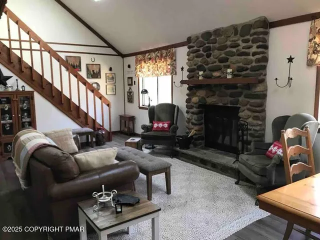 a kitchen with stainless steel appliances granite countertop a stove a refrigerator and a microwave