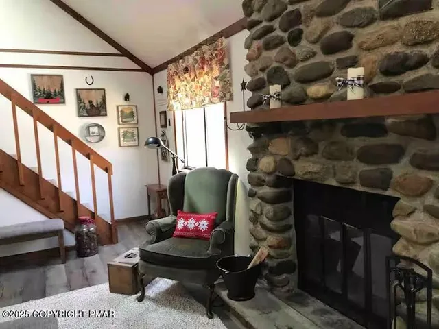a living room with furniture and a rug