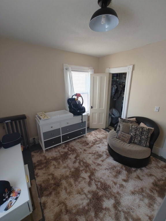 24 Hampden Street West Springfield, MA 01089 - Photo 11 of 18 a living room with furniture and a air conditioner vent