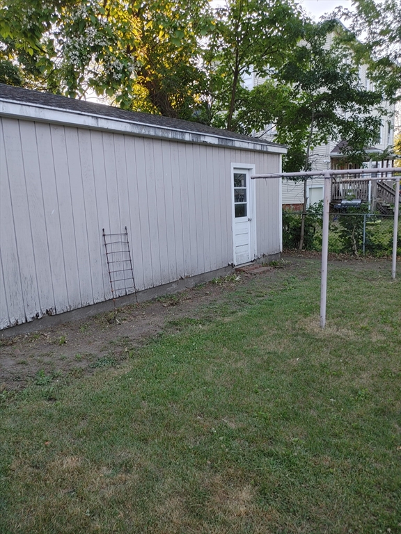 24 Hampden Street West Springfield, MA 01089 - Photo 17 of 18 a backyard of a house with plants and tree