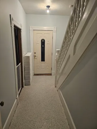 a view of a hallway with windows