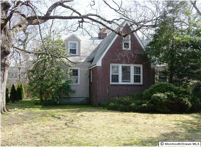 81 Garden Road Little Silver, NJ 07739 - Photo 2 of 3 a house that has a tree in front of the house