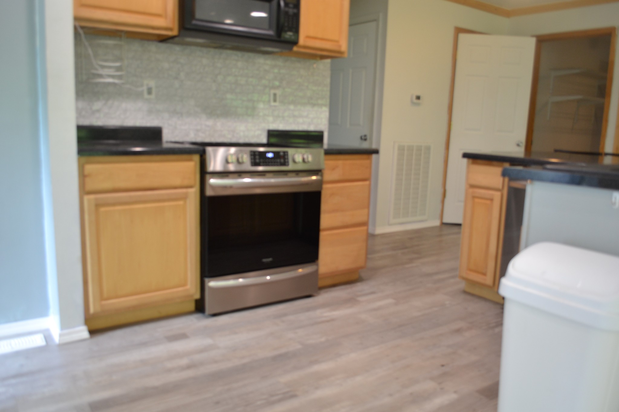 1505 Add Stafford Road Hilham, TN 38568 - Photo 26 of 65 a kitchen with a stove and a microwave
