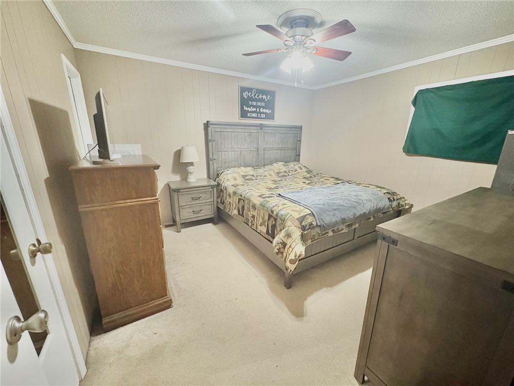 1404 Farrs Bridge Road Easley, SC 29640 - Photo 13 of 27 This cozy bedroom features comfortable flooring and crown molding, creating a relaxing private retreat.