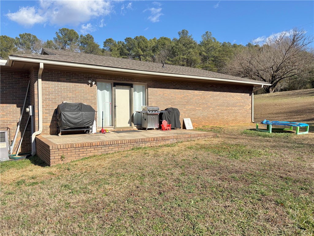 1404 Farrs Bridge Road Easley, SC 29640 - Photo 21 of 27 This brick residence offers a spacious yard, perfect for outdoor entertaining and relaxation.