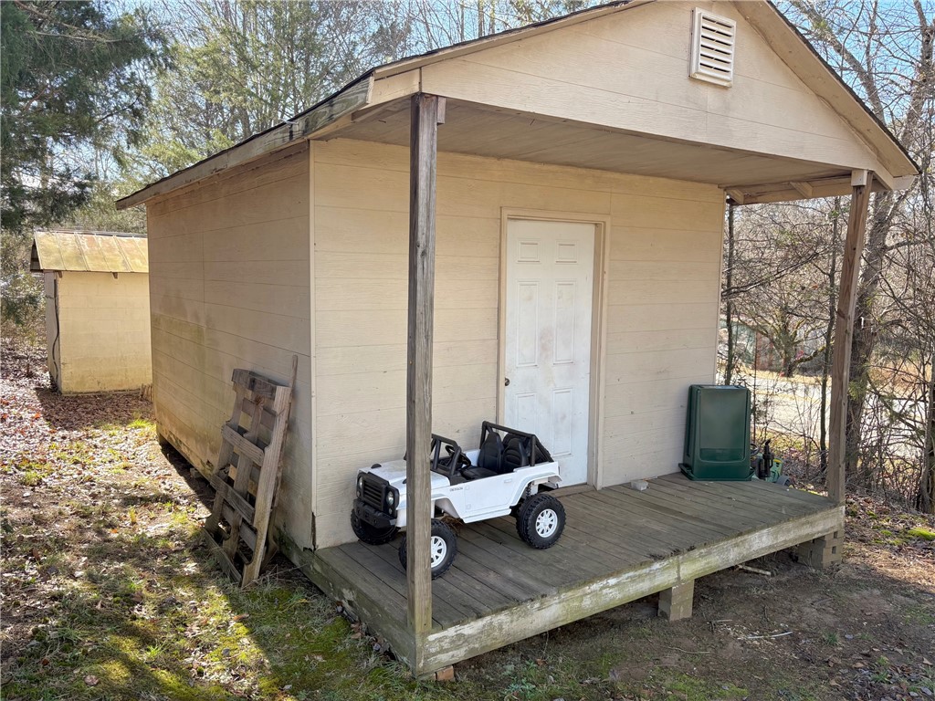 1404 Farrs Bridge Road Easley, SC 29640 - Photo 25 of 27 This structure features a covered porch, offering a functional outdoor space.