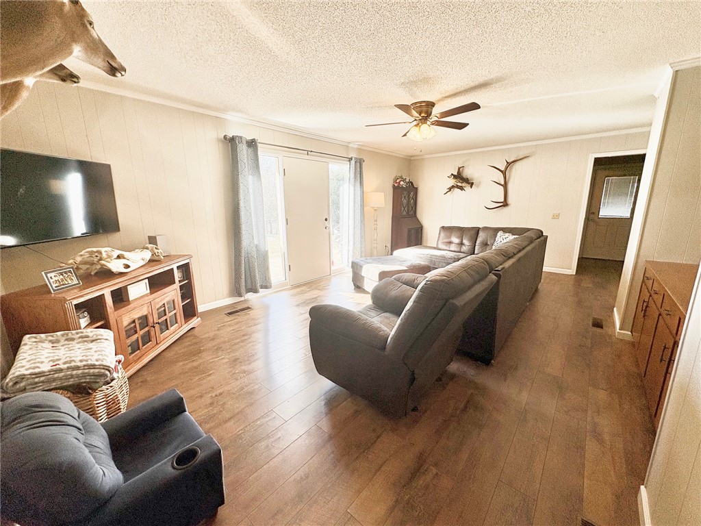 1404 Farrs Bridge Road Easley, SC 29640 - Photo 5 of 27 This inviting living space features rich hardwood flooring and convenient outdoor access.