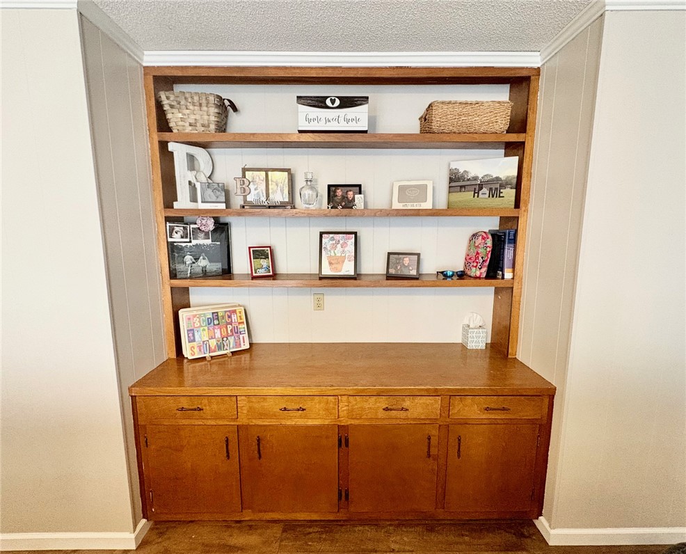 1404 Farrs Bridge Road Easley, SC 29640 - Photo 7 of 27 This built-in shelving unit offers versatile storage and display options for any room.