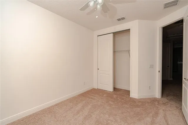 an empty room with a bathroom