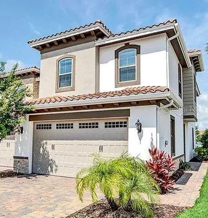 a front view of a house with a garage