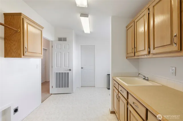 a living room with a bed furniture and a large window
