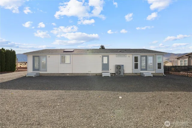 an aerial view of a house with a ocean view