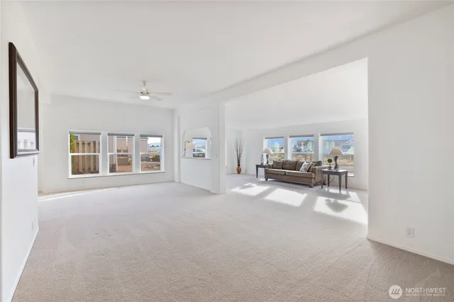 a view of a livingroom with furniture and window