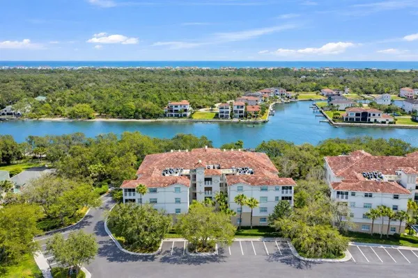 an aerial view of a house with a lake view