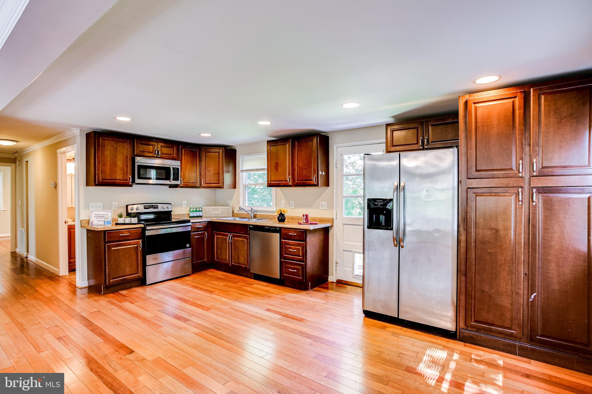 774 Queenstown Road Severn, MD 21144 - Photo 1 of 25 Kitchen w/ Cherry cab, recessed lights & stainless