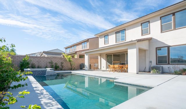 swimming pool view with a outdoor seating