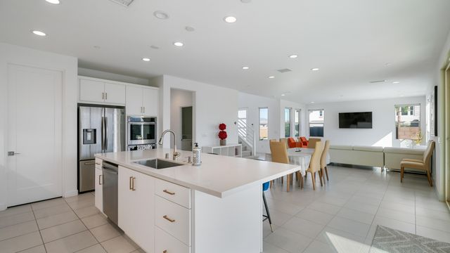 a bathroom with a toilet a sink a mirror and vanity