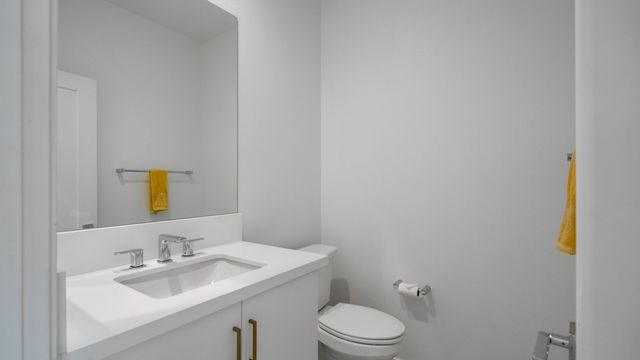 a bedroom with a bed and a table in it