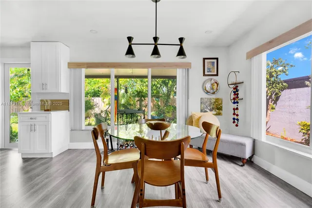 a dining room with furniture mountain view and garden view