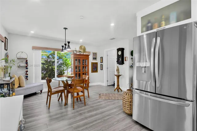 a kitchen with cabinets stainless steel appliances and a counter space