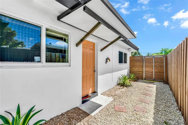 a front view of house with green space