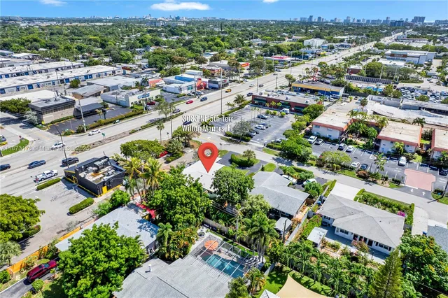an aerial view of residential houses with outdoor space